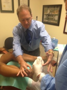 Dr. Goldbaum assisting in the creation of a plaster mold.