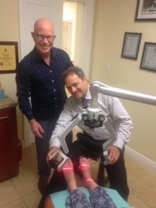 Dr. Bromley (left) and Dr. Goldbaum pose with the new Erchonia 635 Laser.